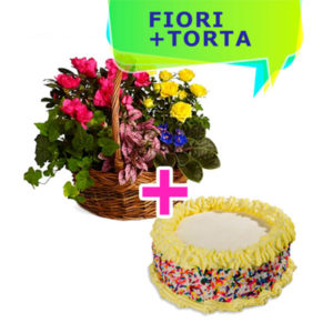 un cestino di fiori colorati dai toni giallo e fucsia e una torta con crema e panna gialla